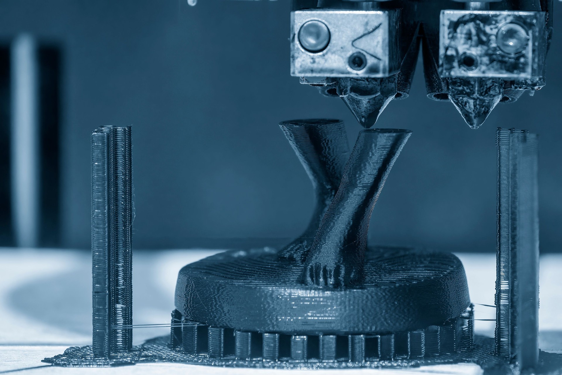 The additive manufacturing by 3D printer machine.