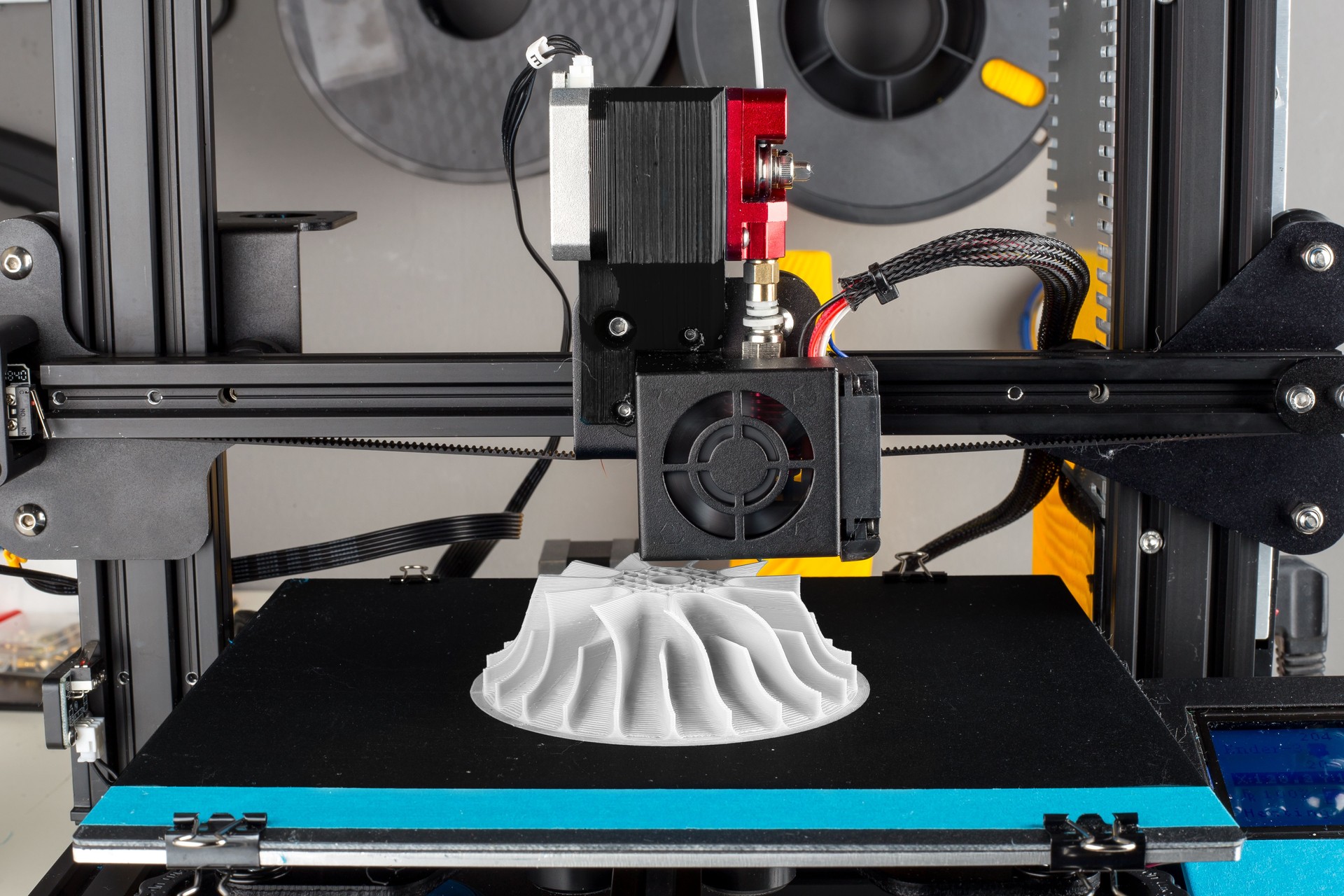 3D printer printing out an compresser wheel for turbo charger